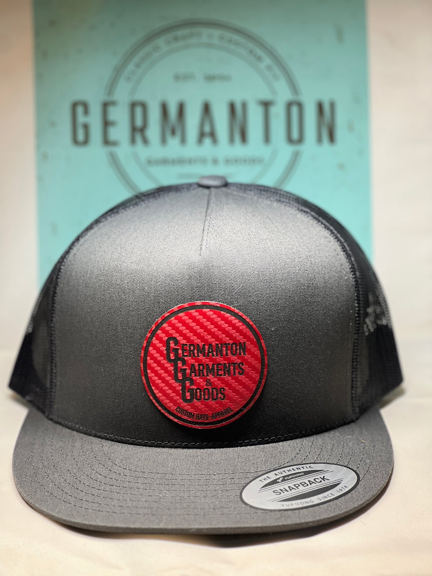 “Germanton Garments and Goods" Logo Hat - Red Carbon Fiber/Black - Yupoong 6006